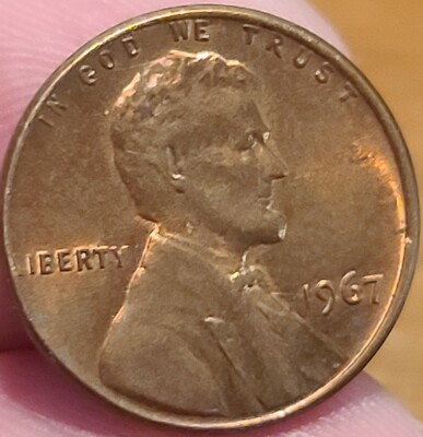 1967 penny off-center strike error showing approximately 50 percent blank planchet with visible date 1967